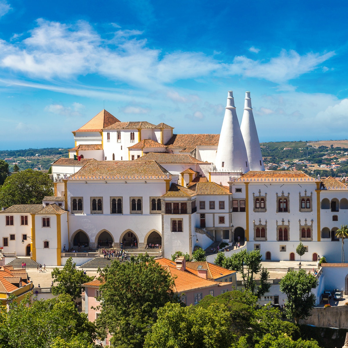 Palace of Sintra (Palacio Nacional de Sintra) in Sintra in a beautiful summer day, Portugal; Shutterstock ID 570271885; Your name (First / Last): Tom Stainer; GL account no.: 65050 ; Netsuite department name: Online Editorial; Full Product or Project name including edition: Best in Travel 2018