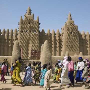 Mali, Djenne. The Great Mosque of Djenne - constructed in 1907 on the foundations of a 13th century mosque built by King Koy Konboro, the 26th ruler of Djenne. This very beautiful mosque is the largest mud structure in the world. The residents of the town