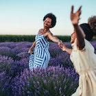 Afro mother and her daughter bonding together outdoors at the lavender field