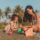 Mother and daughter relaxing on the beach together.
1055292950