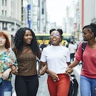 Multi nationality women walking through Tokyo