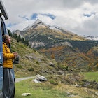 A mature man, parked up in his campervan above Gavarnie in the Hautes-Pyrenees, takes in the view of the surrounding mountains. He wears a yellow puffer jacket and holds a hot drink.
1776564269
pic du piméné