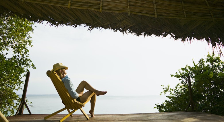 Bocas del Toro Island, Caribbean coast, Panama
200254863-001
vacation, leisure, relaxed
A woman relaxing on the deck of a seaside bungalow in Bocas del Toro Island, Panama