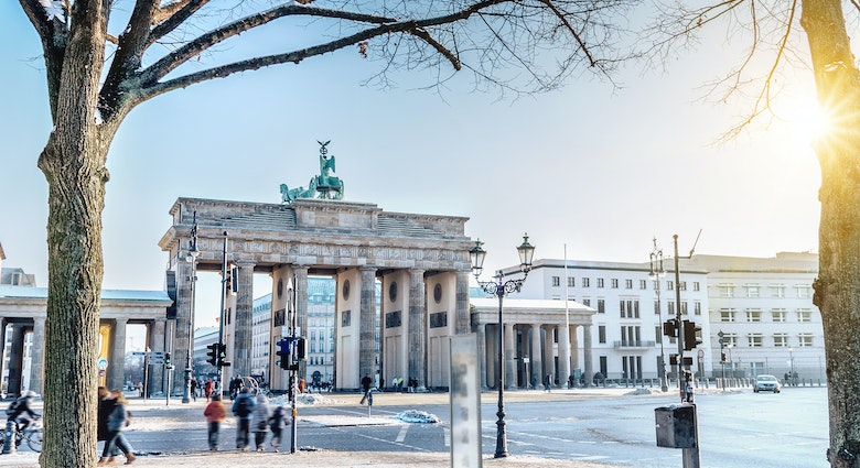 view on winterly Berlin Brandenburger Tor in morning sun
638326526
Capital Cities, Tourism, Paris Platz, Quadriga Statue - Brandenburg Gate, Color Image, Walking, History, Cultures, Famous Place, Architecture, Travel Destinations, Outdoors, Horizontal, Tourist, People, Brandenburg Gate, Berlin, Germany, Europe, Tree, Sunlight, Day, Winter, Sun, Snow, Sign, Symbol, blue sky, Sunny