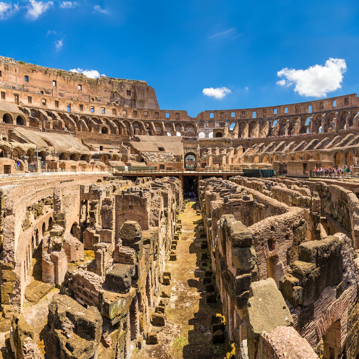 Inside the Colosseum, an amphitheater located in Ancient Rome.
614830518
Lazio, Color Image, Travel Destinations, Horizontal, Panoramic, Famous Place, Photography, Amphitheater, Rome - Italy, Italy, Capital Cities, Roman, Coliseum - Rome, Europe, Monument, Old Ruin, Built Structure, Indoors, Ruin, Innovation, Rome