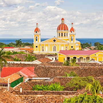 The city of Granada and the landmark Cathedral of Granada in Nicaragua with Lake Nicaragua in the background.
