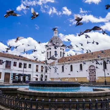 Ecuador, Cuenca city center, scenic view of San Sebastian church with fountain in foreground