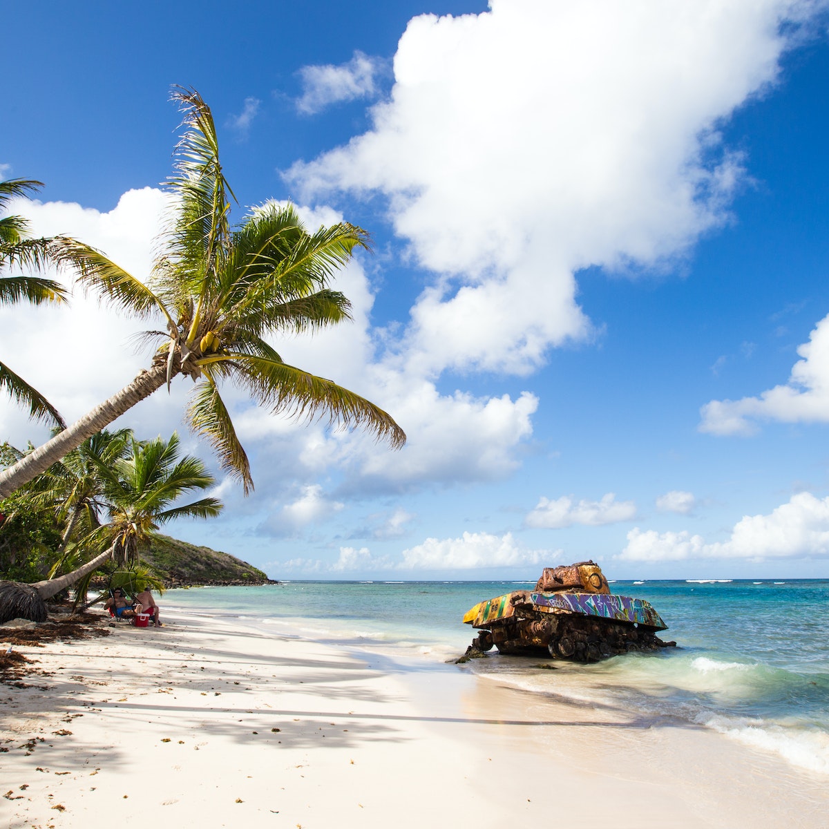 Military tank left behind on Culebra Beach.
482509777
outdoor, tree, island, usa, tropical, travel, sand, holiday, summer, sun, paradise, lagoon, caribbean, beach, tanks, blue, bay, sky, sea, beautiful, water, nature, palm, vacation, landscape, ocean, culebra, white, puerto, flamenco, rico