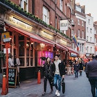 April 14, 2019: People walking past Ku Bar, one of the largest gay bars in London, located just off Leicester Square.